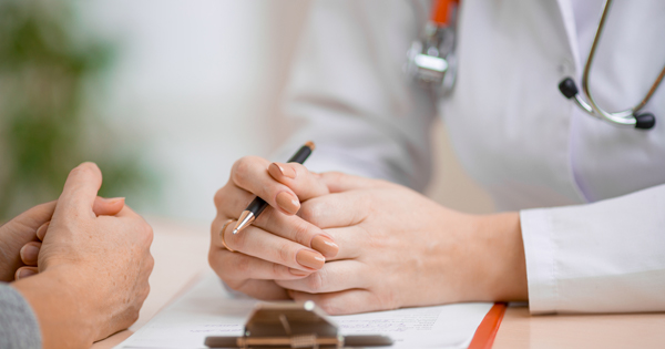 doctor telling patient they have cancer