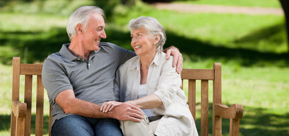 senior couple sitting on bench