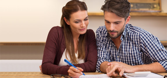 couple looking at health insurance policy