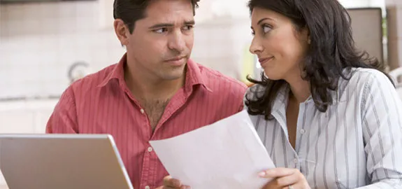 couple looking at medical bills