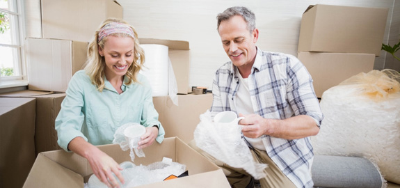 senior couple moving into apartment