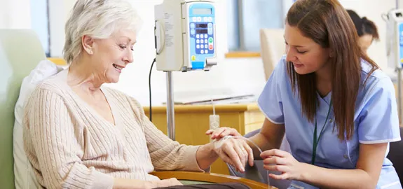 nurse giving patient chemotherapy