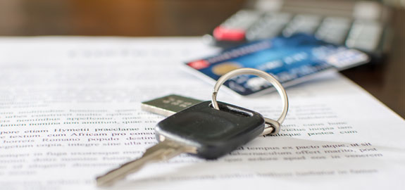 Keys and card on paperwork