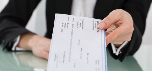 Woman handing check