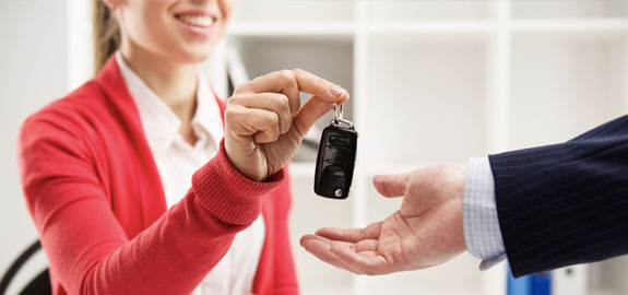 Saleswoman handing out keys